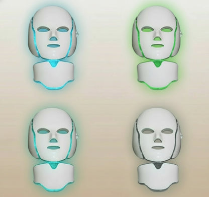 Four LED face masks with different colored lights on a white background