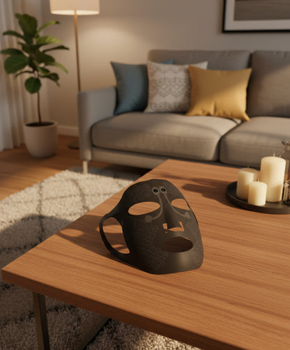 Black face mask with white accents on a white background