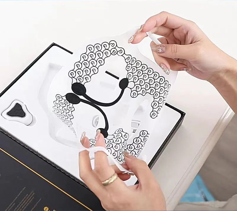 Person holding a clear plastic case with earbud design, showing a close-up of the product.