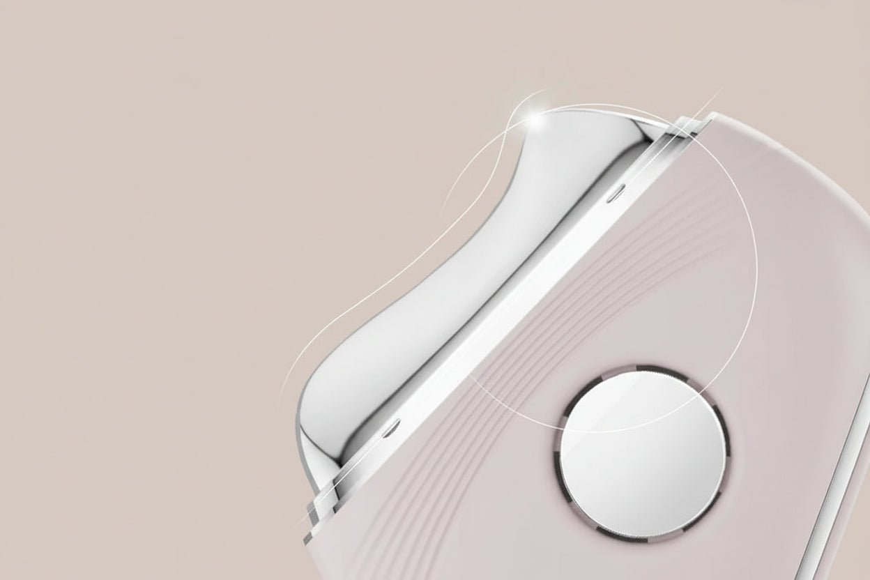Hot & Cold LED Microcurrent Beauty Device with a metallic cover on a beige background
