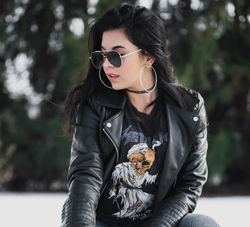 modern-leather-jacket-woman sitting on bench