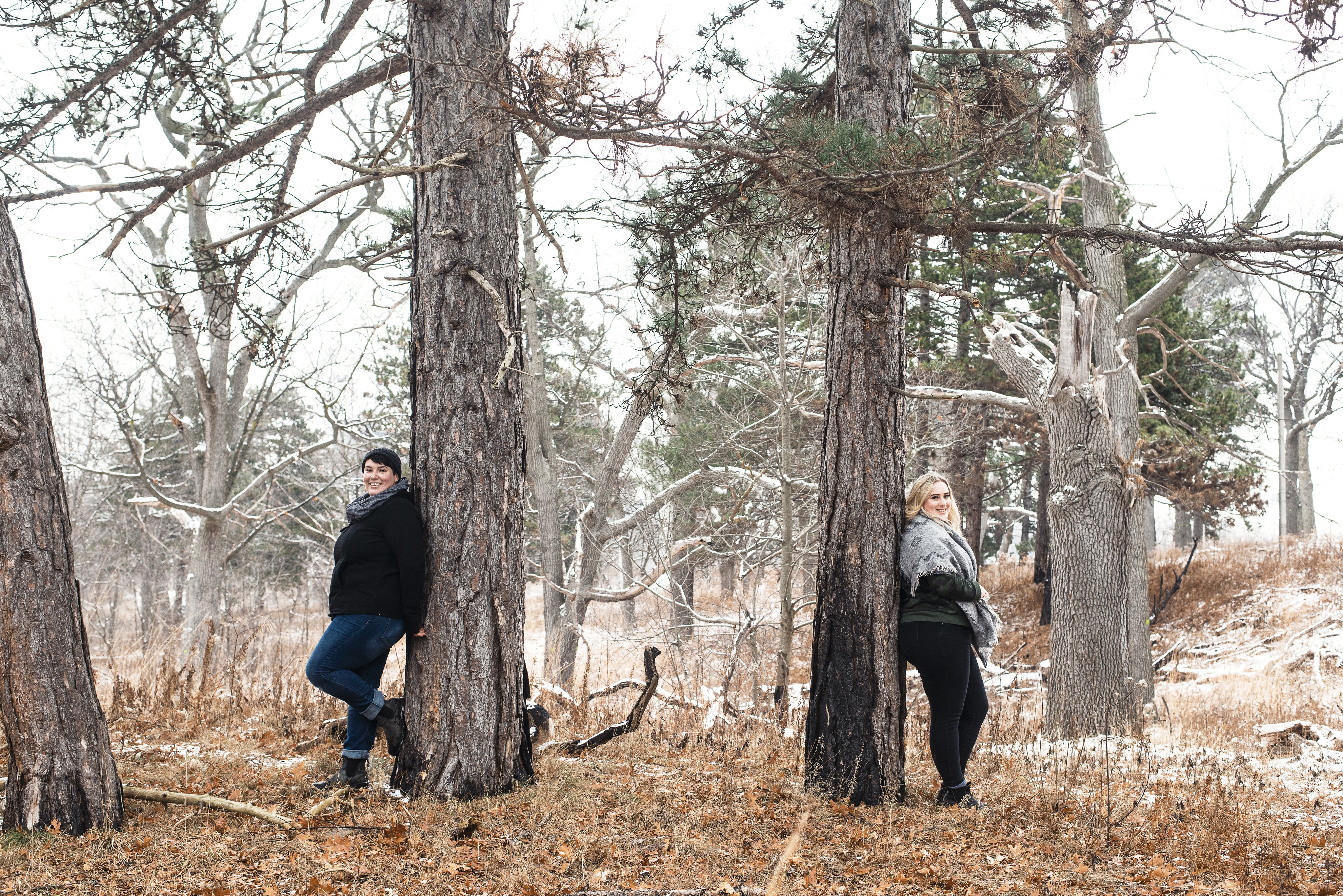 women-standing-against-trees