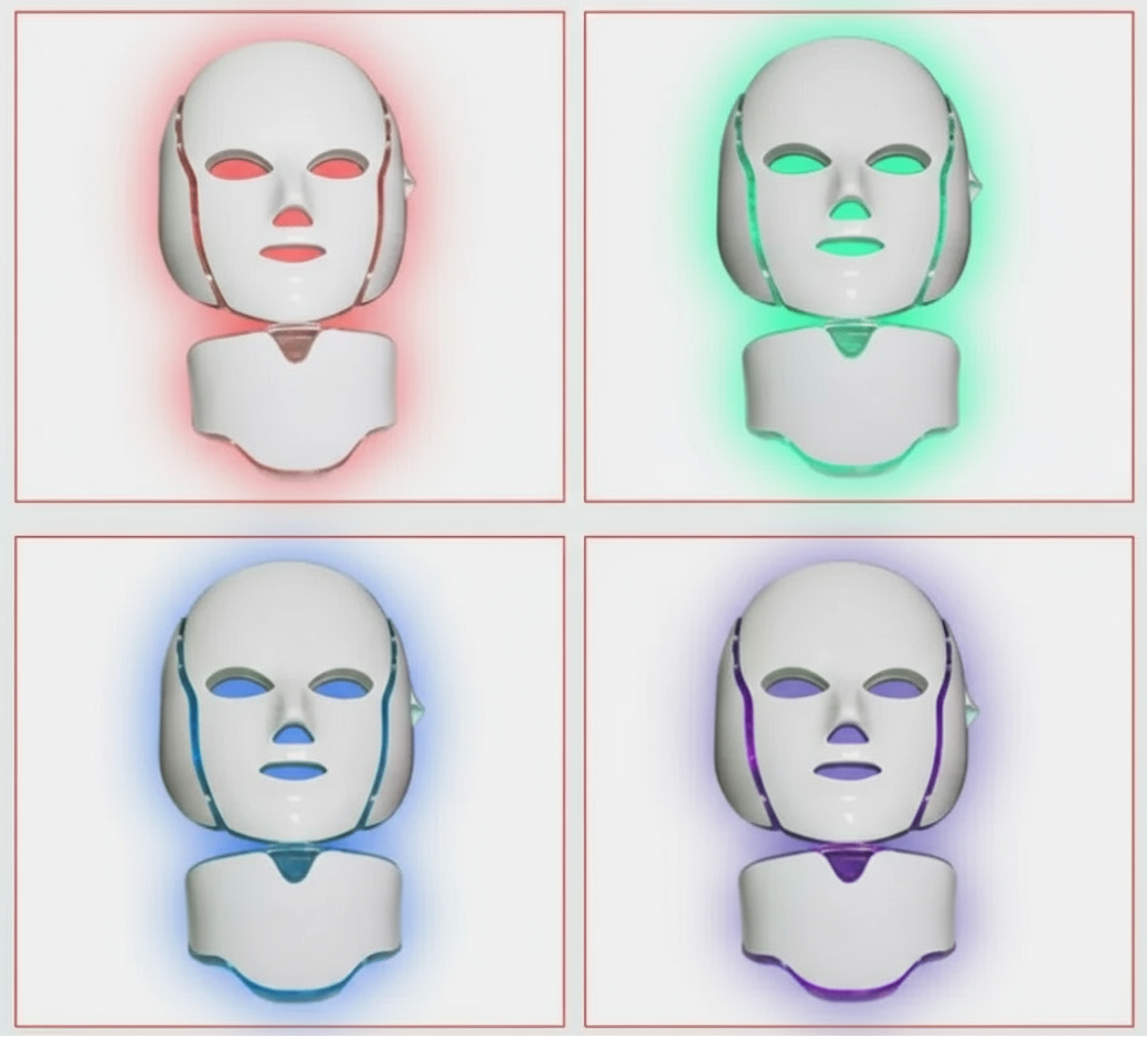 Four LED face masks with red, green, blue, and purple lights on a white background.