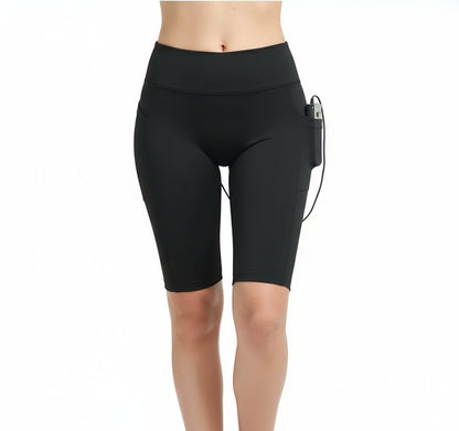 Black athletic shorts with a small electronic device on a white background