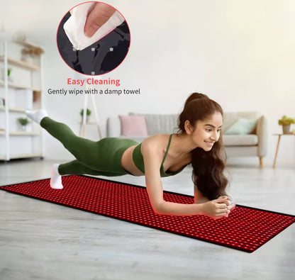 Woman exercising on a red and black yoga mat with cleaning instructions.