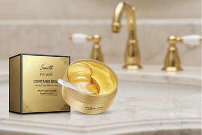 Gold eye mask packaging with a spoonful of mask on a bathroom counter.