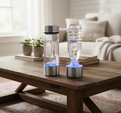Two hydrogen water bottles with blue lights on a black background
