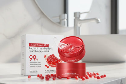 Pomegranate eye mask packaging with red jar and box on a bathroom counter.