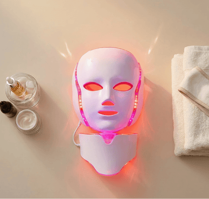 LED face mask with skincare products and a towel on a beige background, featuring NuYOU360 branding.
