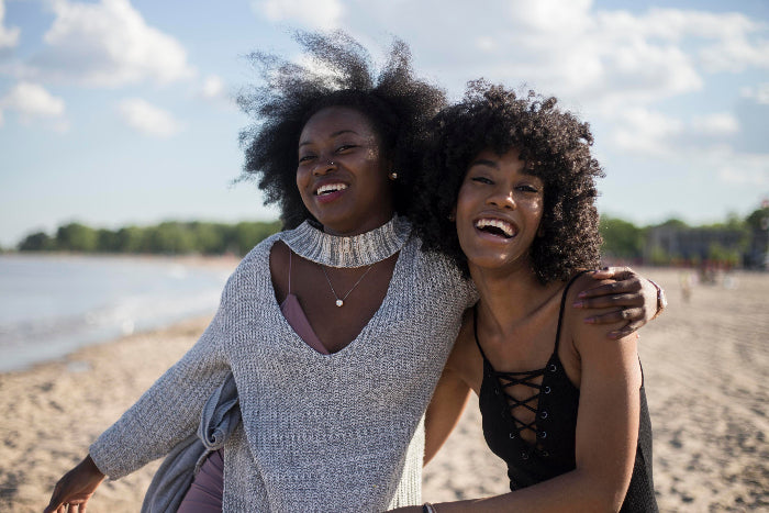 Friends-laughing-on-beach