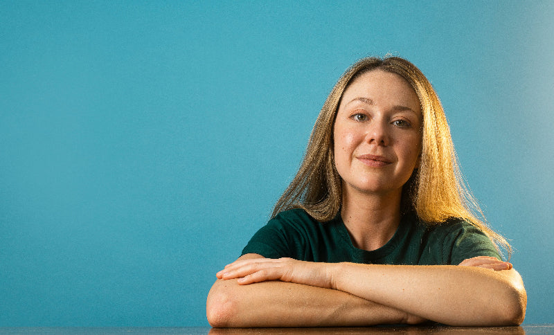 portrait-of-a-woman-with-long-brown-hair-and-crossed-arms