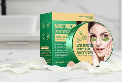 Packaging of moisturizing soft eye masks with a woman's face on it, on a white background.