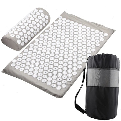 Acupressure mat with pillow and carrying bag on a white background